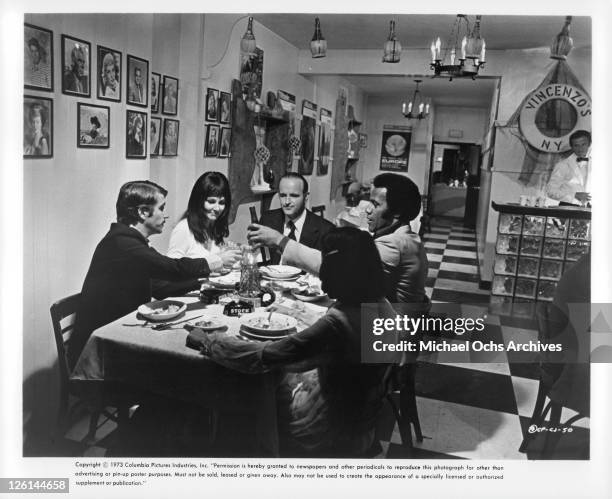 Peter Boyle presides over a restaurant dinner celebration with his bodyguard Henry Winkler, his girl Paula Prentiss and his confederate Fred...