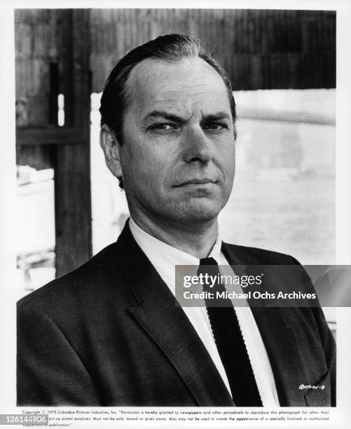 Rip Torn in coat and tie in a scene from the film 'Crazy Joe', 1973. (Photo by Columbia Pictures/Getty Images