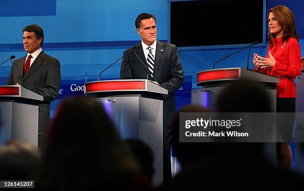 Republican presidential candidates ,Texas Gov. Rick Perry, former Massachusetts Gov. Mitt Romney, and Rep. Michele Bachmann , participate in the Fox...