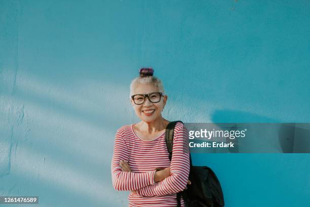 happiness face of senior hipster thai woman - showus stock pictures, royalty-free photos & images
