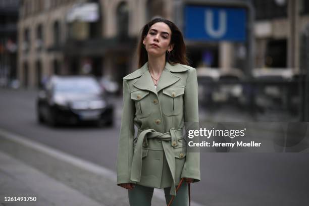 Frankie Miles wearing Sif Jacobs earrings, andotherstories blazer and Mango pants on July 27, 2020 in Berlin, Germany.