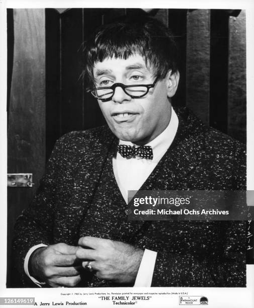 Jerry Lewis with glasses, bow tie and buck teeth in a scene from the film 'The Family Jewels', 1965.