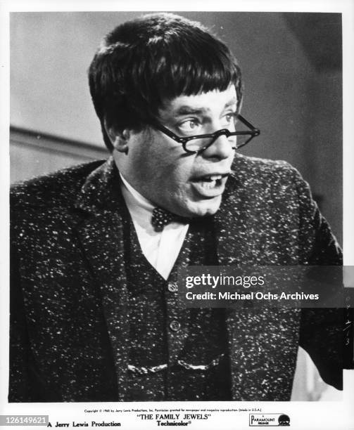 Jerry Lewis with glasses, bow tie and buck teeth in a scene from the film 'The Family Jewels', 1965.