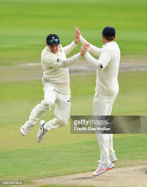 Dominic Bess of England celebrates after running out Roston Chase of West Indies with Stuart Broad of England during Day Five of the Ruth Strauss...