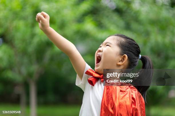hero girl take off - superhero girl stock pictures, royalty-free photos & images