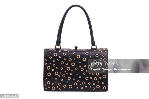 black leather purse with gold grommets on white background - gold purse stock pictures, royalty-free photos & images