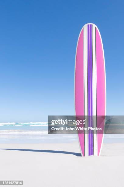 pink and purple retro surfboard - surfboard stock pictures, royalty-free photos & images