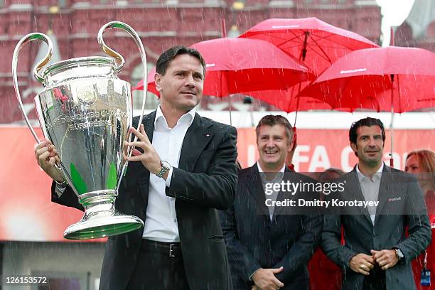 Dmitri Alenichev holds the trophy during the UEFA Champions League Trophy Tour 2011 on September 23, 2011 in Moscow, Russia.