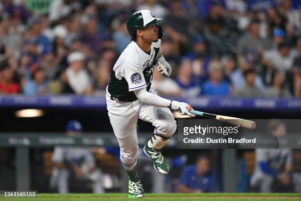 Ezequiel Tovar of the Colorado Rockies hits a three RBI double to retake the lead in the sixth inning during the game between the Los Angeles Dodgers...
