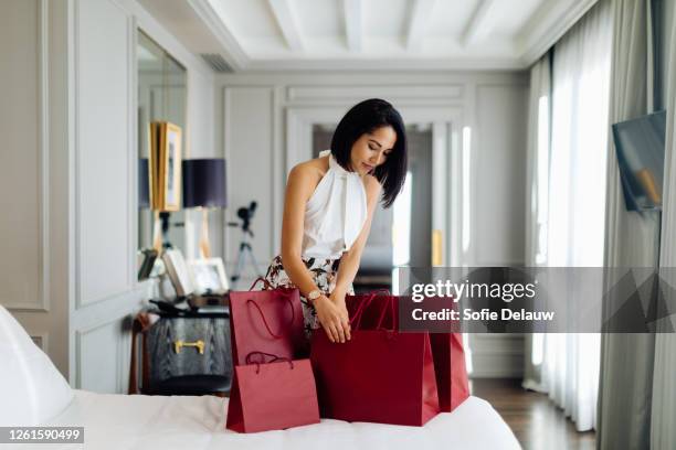 fashionable woman with shopping bags in suite - grocery bag stock pictures, royalty-free photos & images