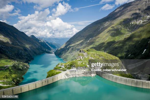 aerial view of lake mooserboden and dam wall, kaprun high mountain reservoirs, salzburg, austria - staudamm stock-fotos und bilder