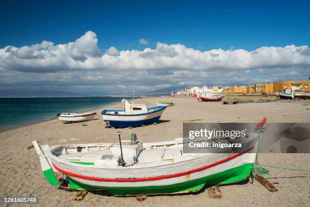 fishing boats at san miguel beach, cabo de gata, almeria, andalusia, spain - cabo de gata stock pictures, royalty-free photos & images