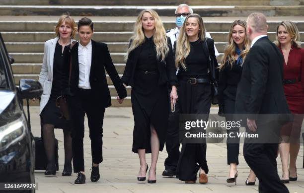 Amber Heard departs with her girlfriend Bianca Butti and sister Whitney Heard, the Royal Courts of Justice, the Strand on July 28, 2020 in London,...