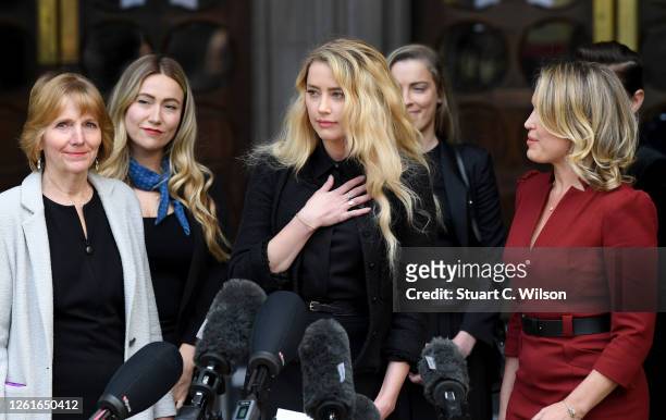 Amber Heard speaks outside the Royal Courts of Justice, the Strand on July 28, 2020 in London, England. The Hollywood actor is suing News Group...