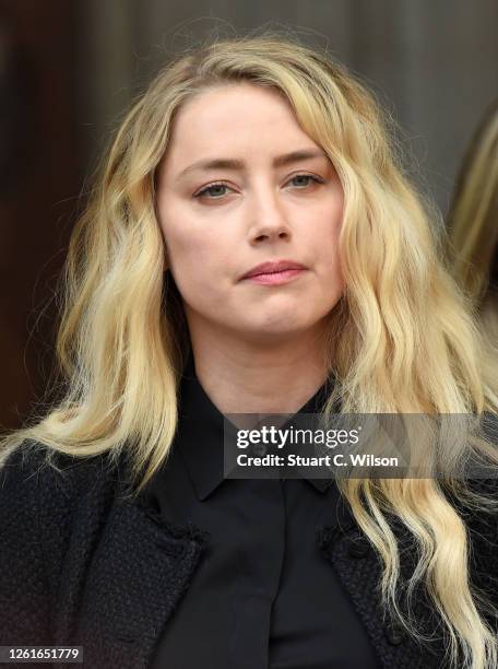 Amber Heard reacts outside the Royal Courts of Justice, the Strand on July 28, 2020 in London, England. The Hollywood actor is suing News Group...