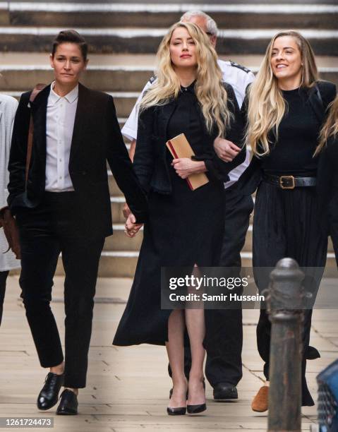 Amber Heard departs with her girlfriend Bianca Butti and sister Whitney Heard from the Royal Courts of Justice, Strand on July 28, 2020 in London,...