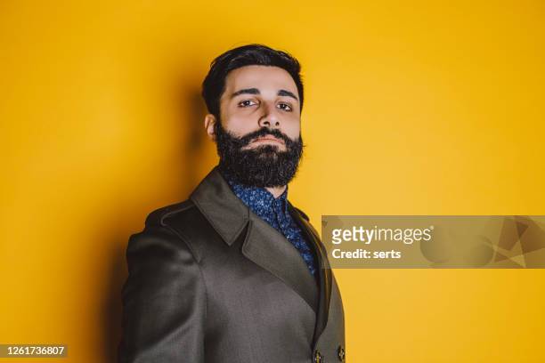 portrait of serious young man with beard - turkey middle east stock pictures, royalty-free photos & images