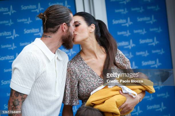Real Madrid player Sergio Ramos and his wife Pilar Rubio present their new born child Maximo Adriano at La Moraleja Hospital on July 28, 2020 in...