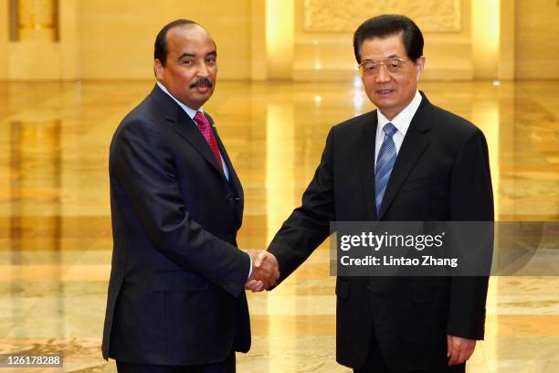 Mauritanian President Mohamed Ould Abdel Aziz shakes hands during a meeting with Chinese President Hu Jintao at the Great Hall of the People on...