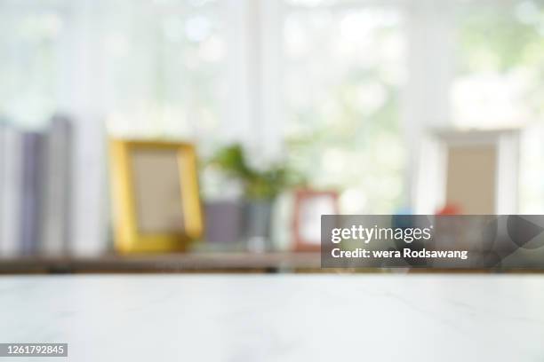 empty marble table with shelf decorate background - white table stock-fotos und bilder