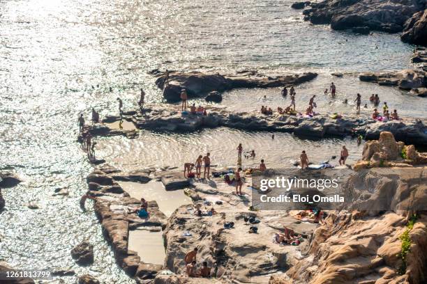 aerial view of calafuria rock beach with roman bath, livorno, tuscany. italy - boat in bath tub stock pictures, royalty-free photos & images