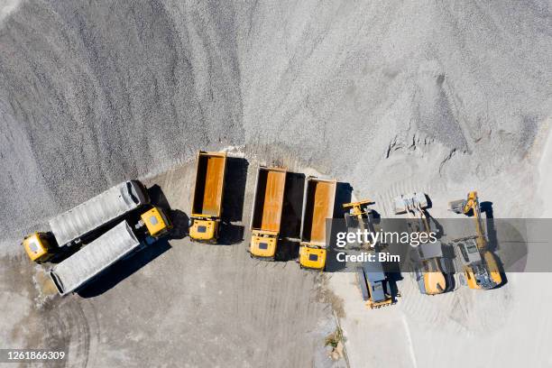 dump trucks and construction machines, aerial view - mining from above stock pictures, royalty-free photos & images