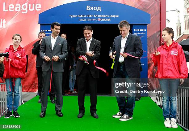 Luis Figo, Dmitri Alenichev and Davor Suker cut tape during opening ceremony of the UEFA Champions League Trophy Tour 2011 on September 23, 2011 in...