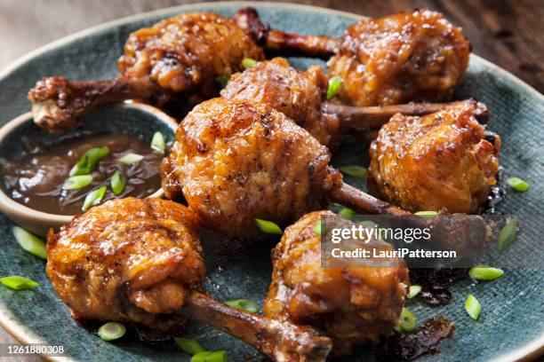 honey garlic lollipop chicken wings with carrots, celery and ranch dip - lollipop stock pictures, royalty-free photos & images