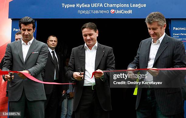 Luis Figo, Dmitri Alenichev and Davor Suker cut tape during opening ceremony of the UEFA Champions League Trophy Tour 2011 on September 23, 2011 in...