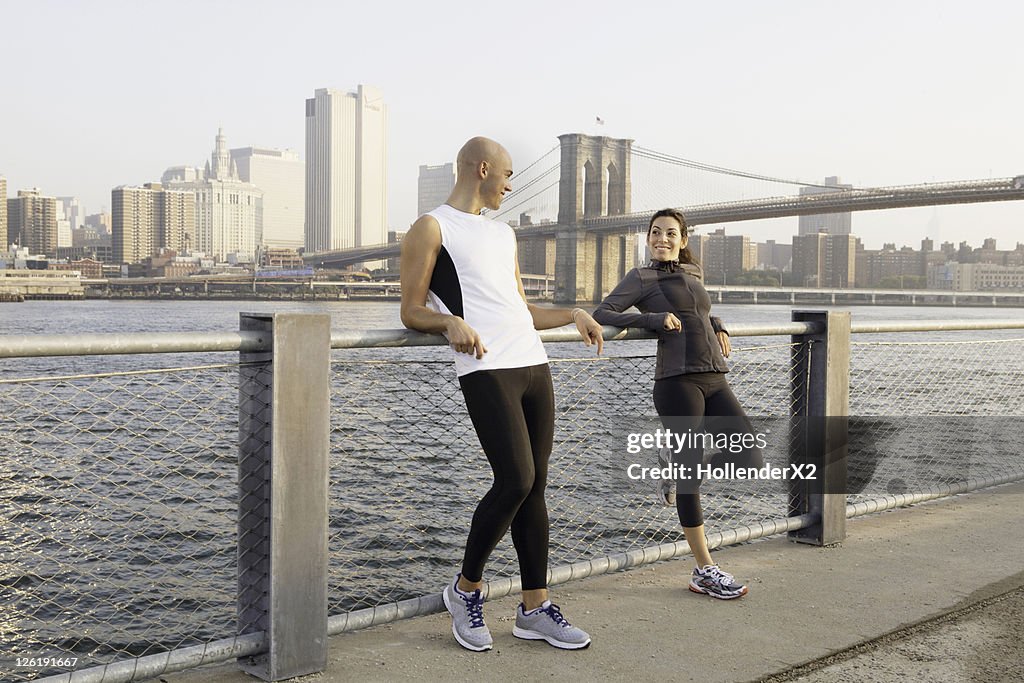 Couple in workout clothes smiling