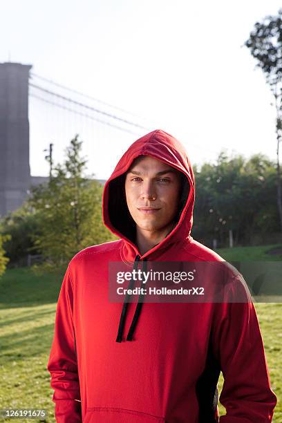 portrait of man with sweatshirt hoodie - kapuze stock-fotos und bilder