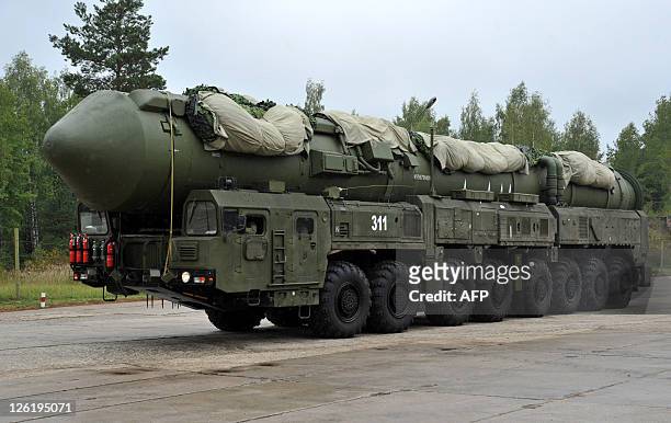 Russian RS-24 Yars thermonuclear intercontinental ballistic missile launcher rolls at a strategic missile forces base near the town of Teykovo, some...