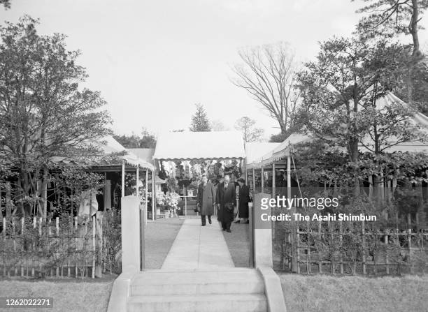 Emperor Hirohito visits the tomb of late Prince Chichibu, his younger brother, with Empress Nagako for the first anniversary of his death at...