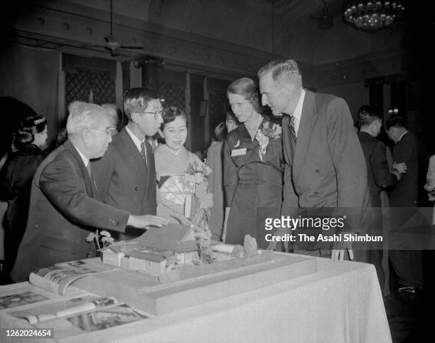 John D. Rockefeller III and his wife Blanchette talk with Prince Mikasa and Princess Yuriko of Mikasa at the Industrial Club of Japan on February 26,...