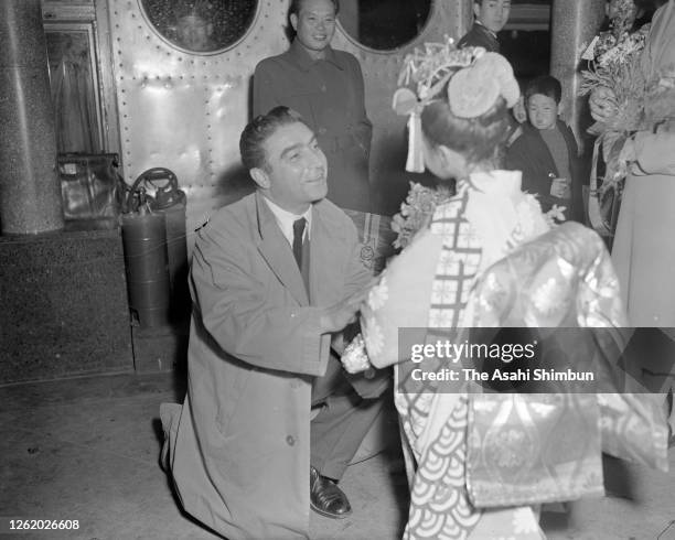 Photographer Robert Capa is seen on arrival at Haneda Airport on April 13, 1954 in Tokyo, Japan.