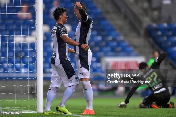 Rogelio Funes Mori of Monterrey celebrates with teammate Jesús Gallardo of Monterrey after scoring his team’s third goal over Luis García of Toluca...