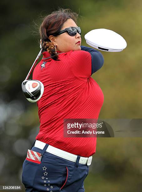 Christina Kim of the USA loses her hat as she tees off during the afternoon fourballs on day one of the 2011 Solheim Cup at Killeen Castle Golf Club...