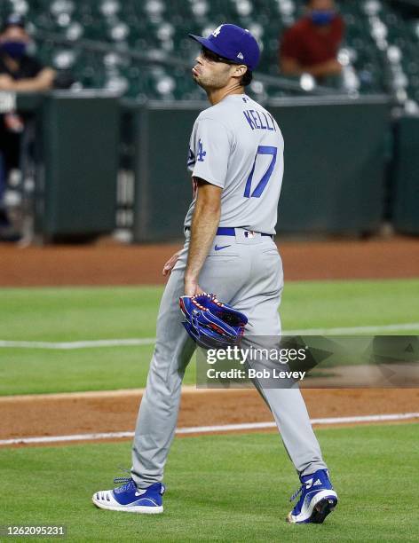 Joe Kelly of the Los Angeles Dodgers reacts after a series of high inside pitches to Carlos Correa of the Houston Astros in the sixth inning at...