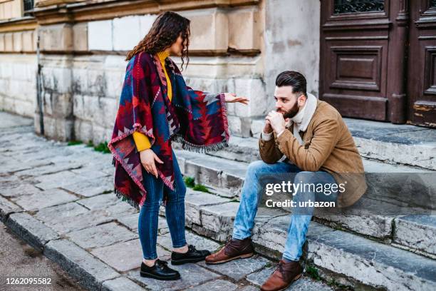 couple arguing outdoors - girlfriend stock pictures, royalty-free photos & images