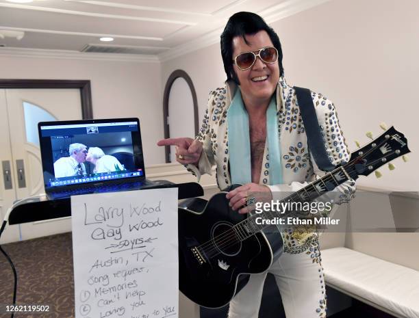 Larry Wood and Gay Wood of Texas are shown on a laptop screen using the Zoom videoconferencing software sharing a kiss as Elvis Presley impersonator...
