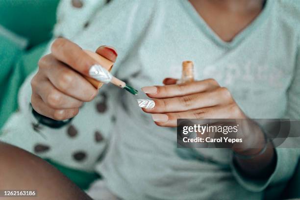 young woman doing manicure at home.closeup - manicure stock pictures, royalty-free photos & images