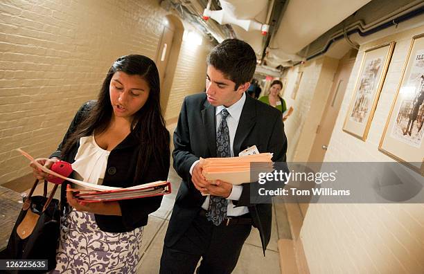 Benjamin Talus and Gabriela Perla, both former House pages, make their way through the Capitol en route to visiting members offices to urge that page...