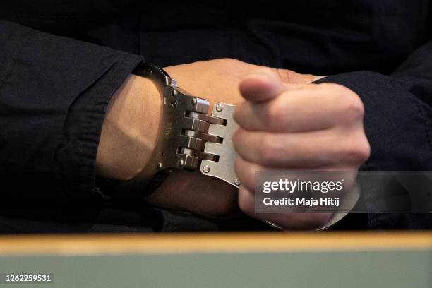 Close-up view of the handcuffs worn by Stephan Balliet as he sits in the courtroom on the fourth day of his trial on July 29, 2020 in Magdeburg,...