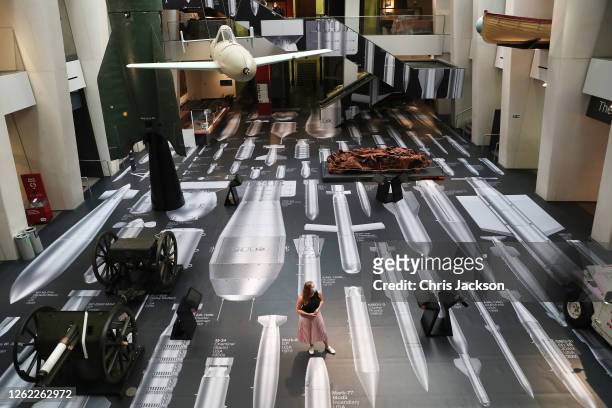 Woman looks on, as Ai Weiwei's "History Of Bombs" is unveiled at the re-opening of the Imperial War Museum on July 29, 2020 in London, England. The...