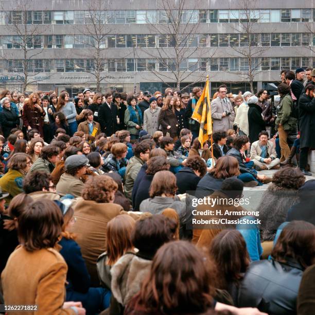 1960s 1970s College Students Peacefully Assembled Standing Sitting On Campus In Protest About An Issue At Sit-In USA