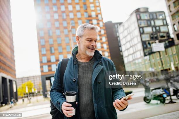 new reality - essential worker going to workplace during quarantine - amsterdam business stock pictures, royalty-free photos & images