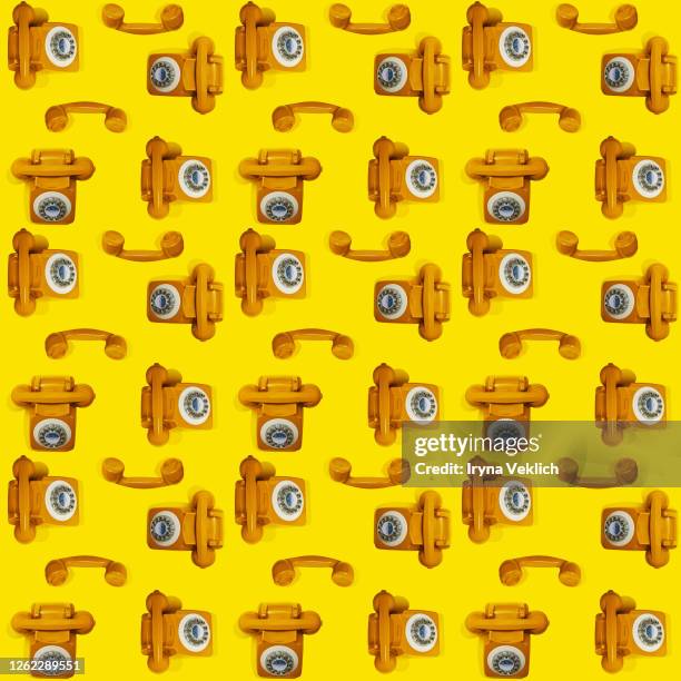 pattern made of yellow handset of a retro telephone. - symbole sonne photos et images de collection