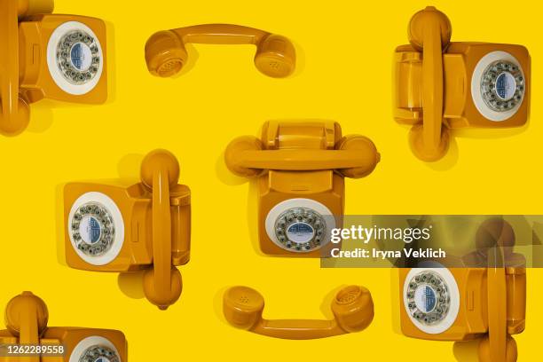 pattern made of yellow handset of a retro telephone. - the fashion institute of technology stock pictures, royalty-free photos & images