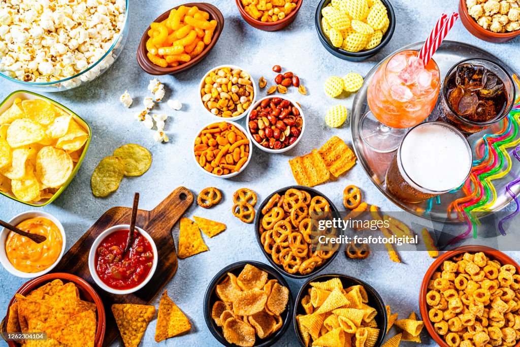 Party Table With Salty Snacks And Drinks Shot From Above High-Res