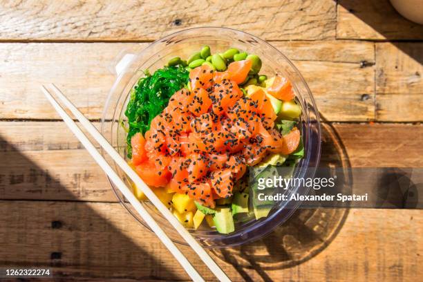 poke bowl with salmon, directly above view - salmon animal stockfoto's en -beelden